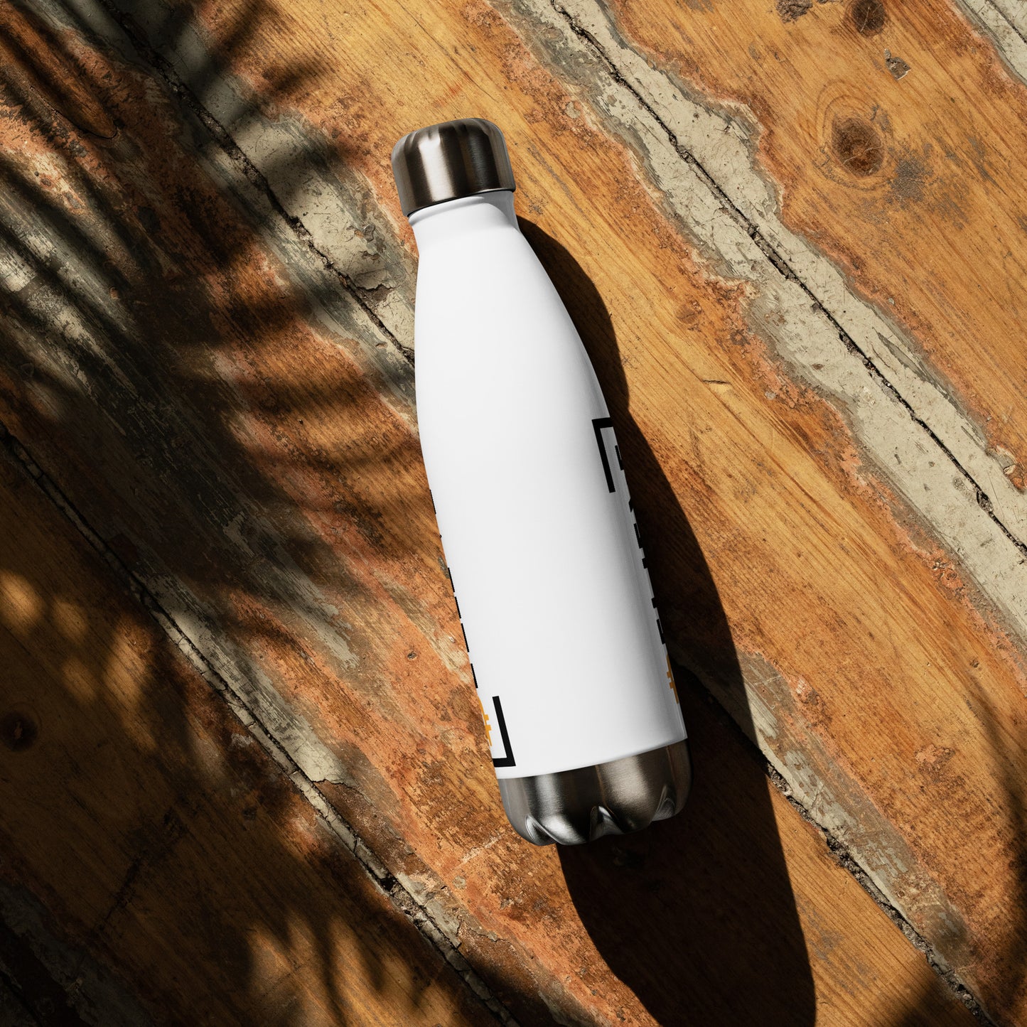 Stainless Steel Water Bottle with Bitcoin Believe Logo on White show on wood surface