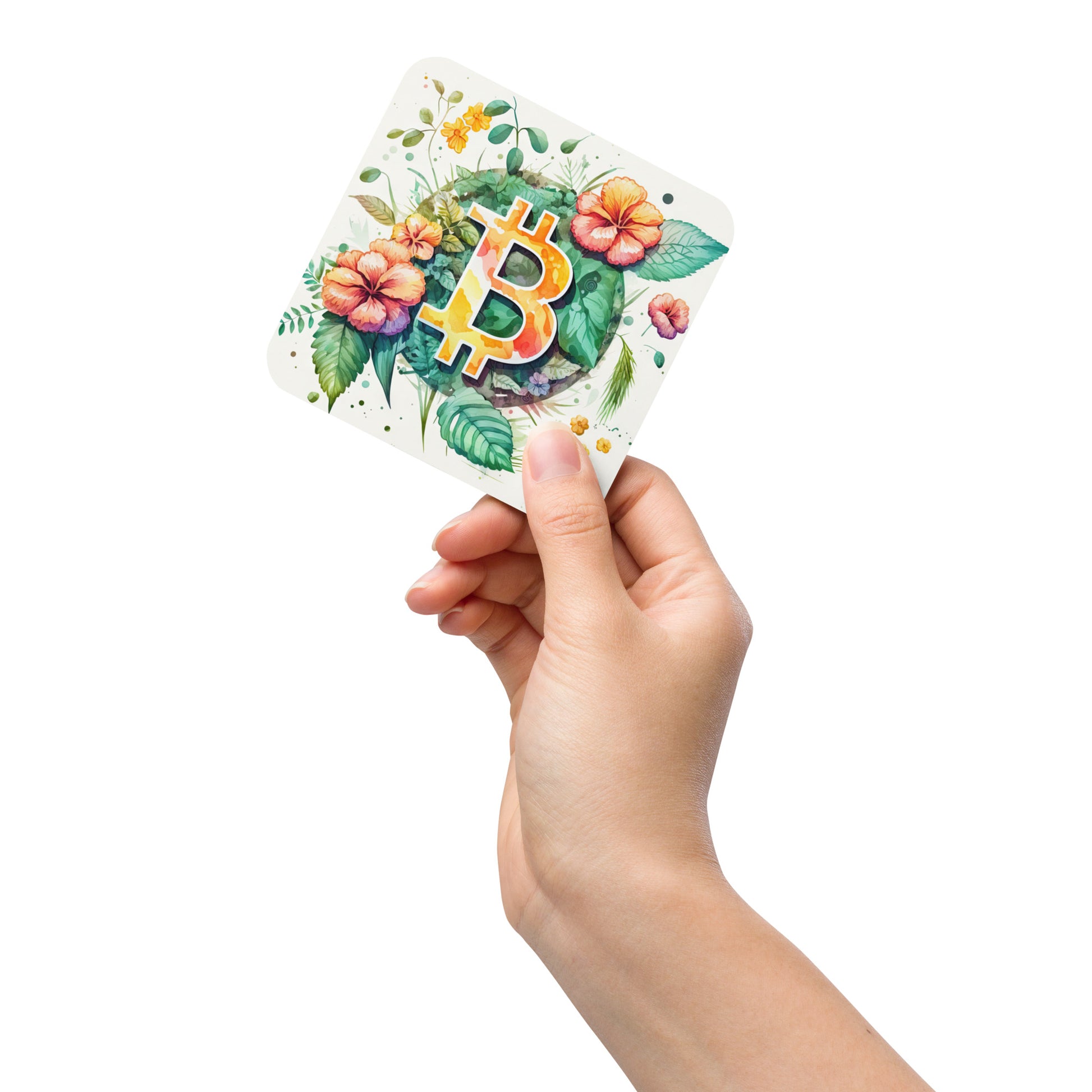 Female hand holding cork back coaster with floral bitcoin logo design on white background. 