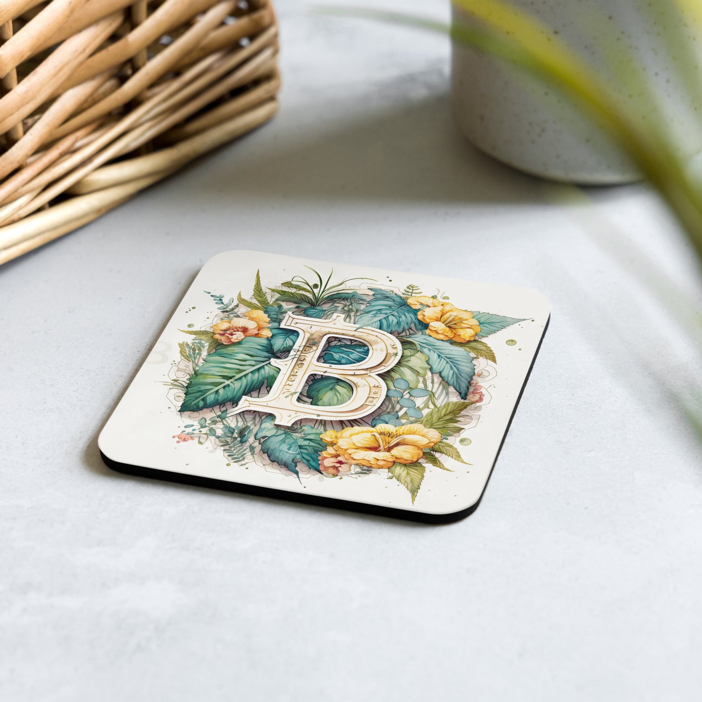 Cork back coaster with floral bitcoin logo design on white background. 